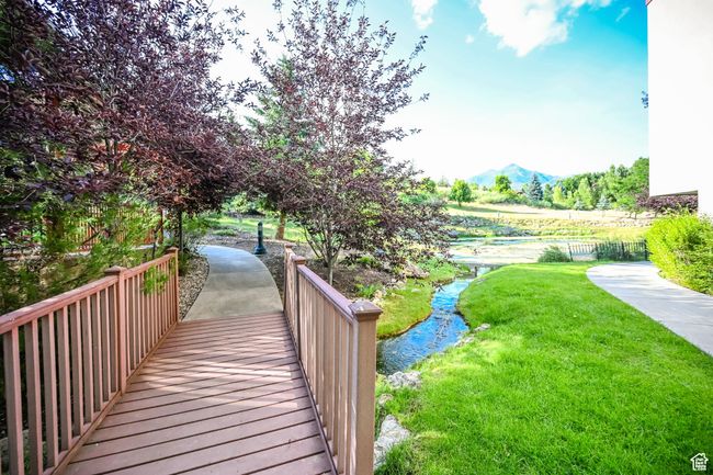 View of community featuring a mountain view and a yard | Image 41