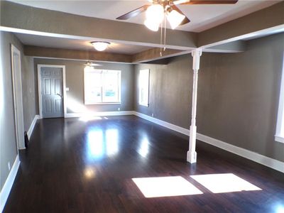 Spare room with ceiling fan and dark hardwood / wood-style flooring | Image 3