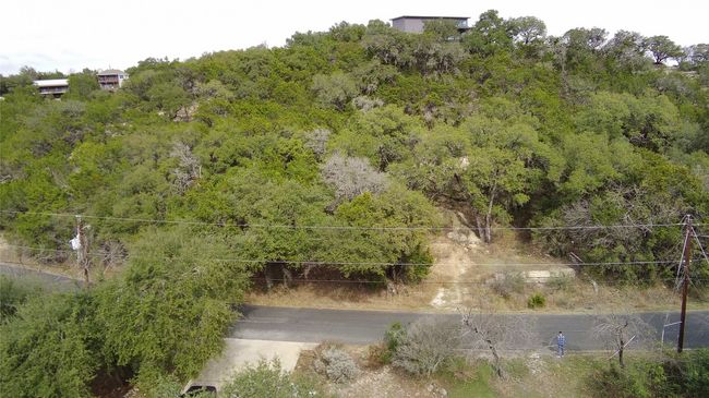Aerial view of a heavily wooded area | Image 9