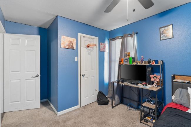 Bedroom with carpet floors and ceiling fan | Image 21