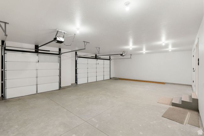 Garage with a garage door opener | Image 16