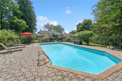 View of pool with a patio area | Image 2