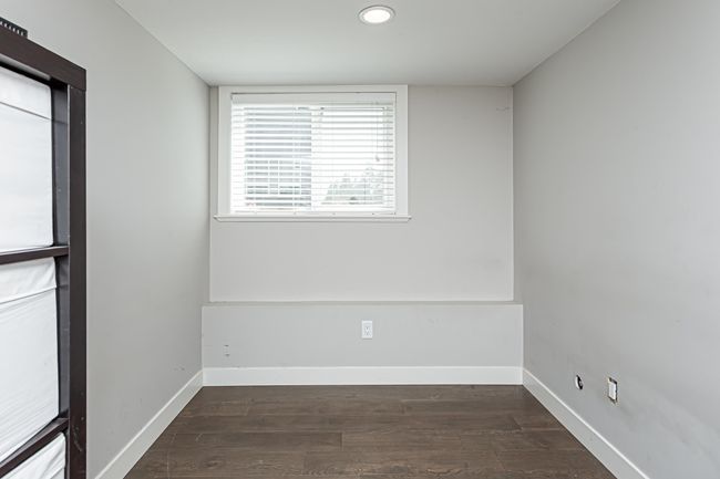 Spare room with recessed lighting, wood finished floors, and baseboards | Image 13