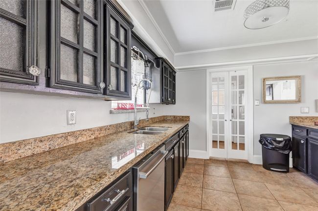 Double doors lead to laundry room | Image 27