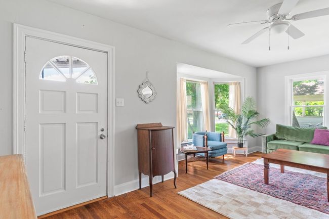 Front door into living room shows expansive living space. | Image 6
