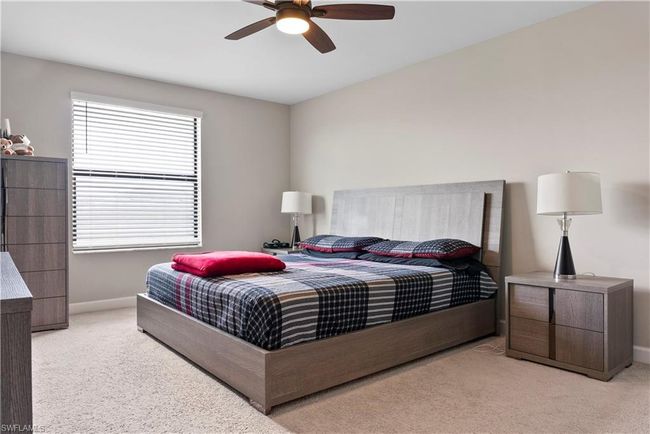 Carpeted bedroom featuring baseboards and ceiling fan | Image 20