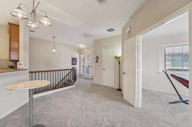 Split-Level Style – Upstairs living offers privacy and quiet away from the entry. | Image 7
