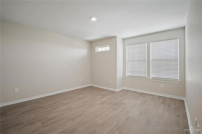 Empty room with wood finished floors | Image 8