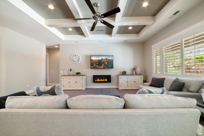 Living area featuring coffered ceiling, beam ceiling, visible vents, and recessed lighting | Image 7