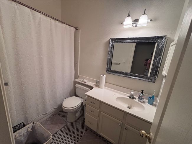Bathroom featuring vanity and toilet | Image 8