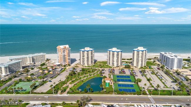 Bird's eye view of a nearby body of water and apartment complex / building | Image 18