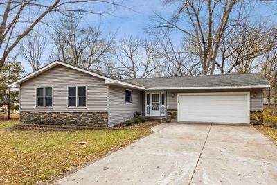 Great rambler/ranch home on a medium wooded lot, newer maintenance free siding, newer windows, 50 year steel roof, long concrete driveway, nice & large 2 level decks in back yard, beautiful home! | Image 1