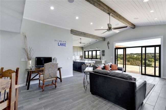 Living room with recessed lighting, ceiling fan, light wood-type flooring, wooden ceiling, and baseboards | Image 6