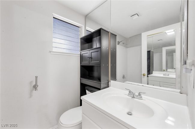Bathroom with walk in shower, visible vents, toilet, and vanity | Image 18