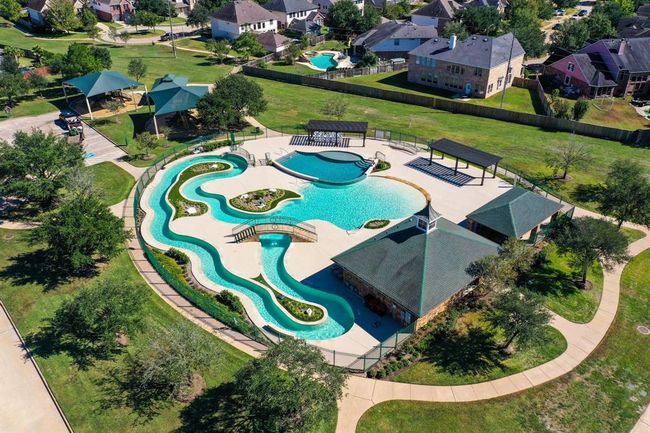 The community offers several options in terms of pools, including a Lazy River, which is extremely relaxing offering a fun day outdoors that includes the option of covered picnic pavilions and kiddie playgrounds. | Image 44