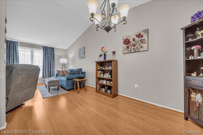 Laminate flooring wraps around through the main living area. | Image 17