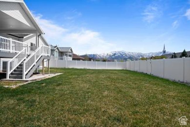 View of yard with a fenced backyard, stairway, and a deck | Image 38