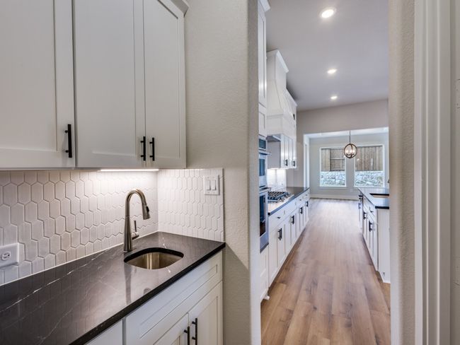 this over the top home features a morning kitchen for additional prep space. | Image 8