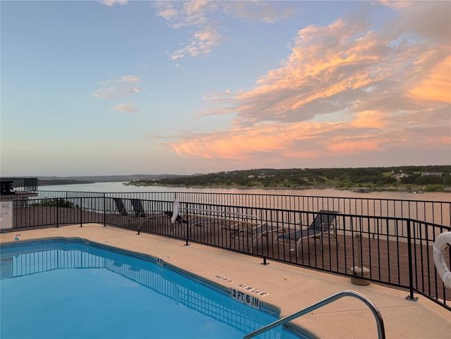 Community pool featuring a water view | Image 25