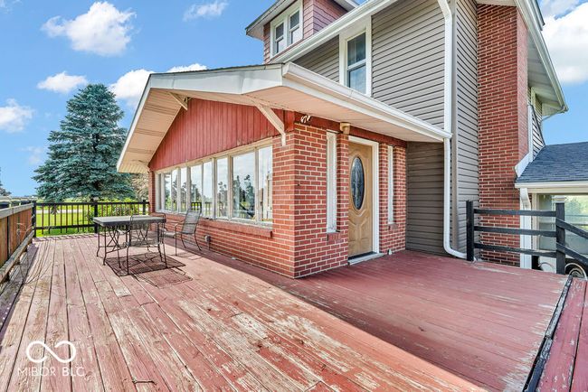 deck with outdoor dining area | Image 7