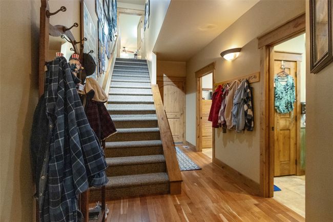 Stairway featuring wood finished floors and baseboards | Image 26