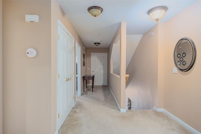 Corridor with light carpet and an upstairs landing | Image 5