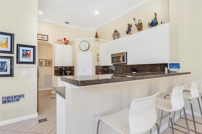 3848 Oak Ridge Cir, House other with 4 bedrooms, 3 bathrooms and null parking in Weston FL | Image 27
