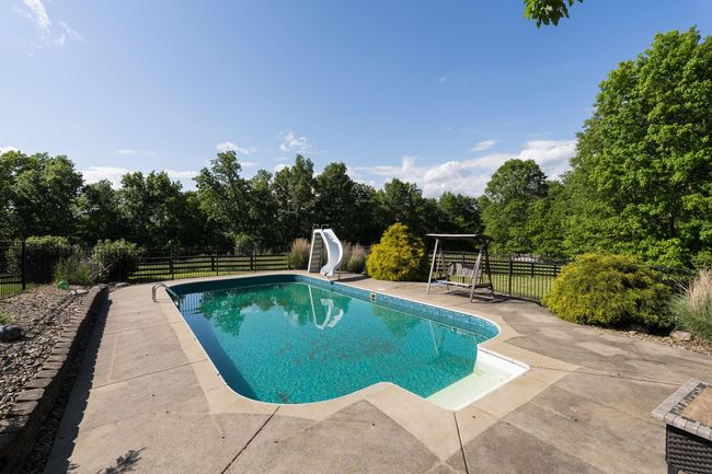 Private Setting with Beautiful Pool Area overlooking the woods. | Image 32