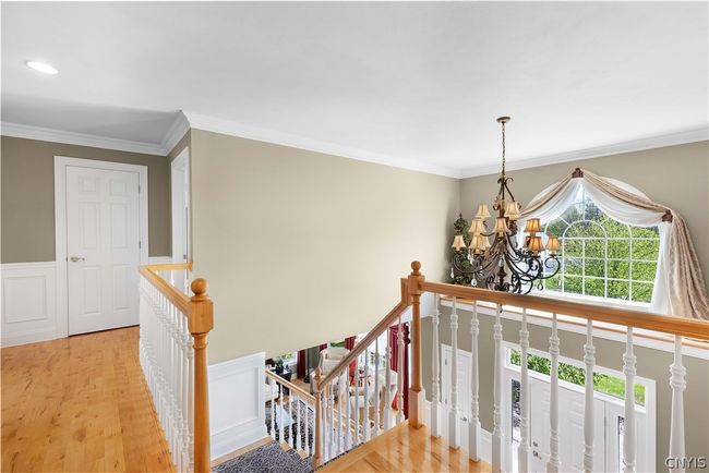 Hallway that leads to the office, powder room, laundry room, mud room and garage. | Image 23