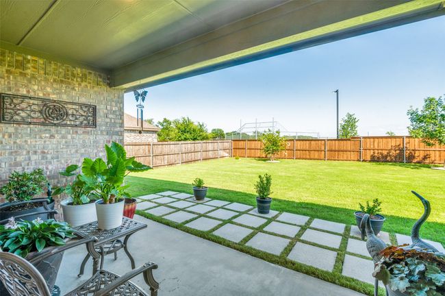 Fenced backyard featuring a patio | Image 24
