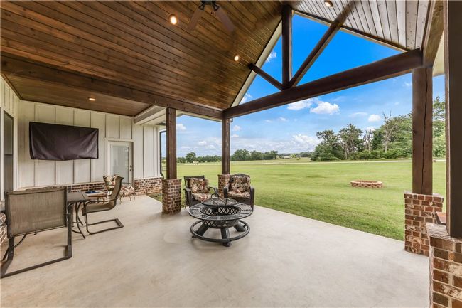 View of patio / terrace with a fire pit | Image 24
