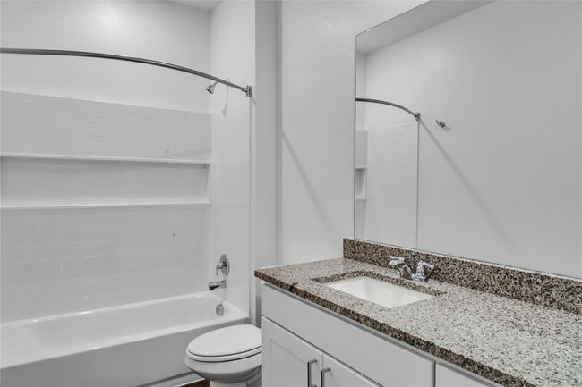 Full bath with shower / washtub combination, vanity, and toilet | Image 8