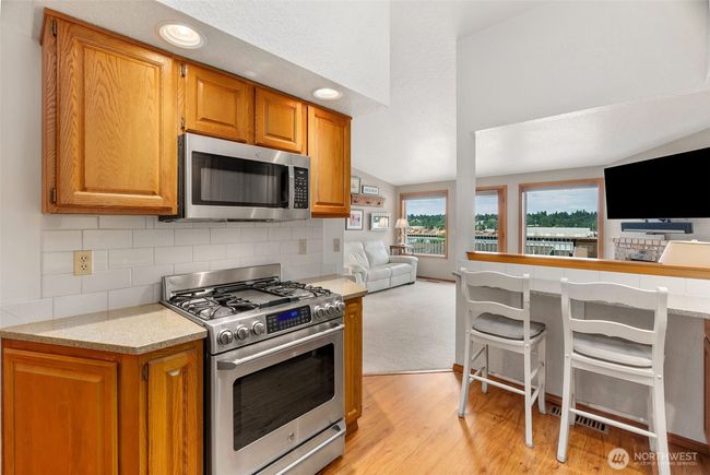 Updated stainless appliances and slab granite counters | Image 18