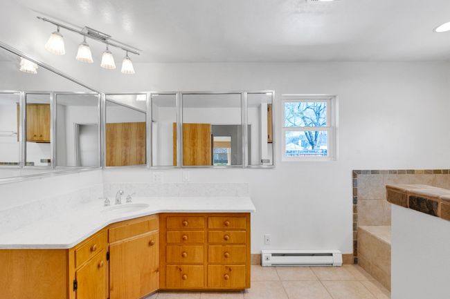 Bathroom featuring tile patterned floors, toilet, vanity, and baseboards | Image 16