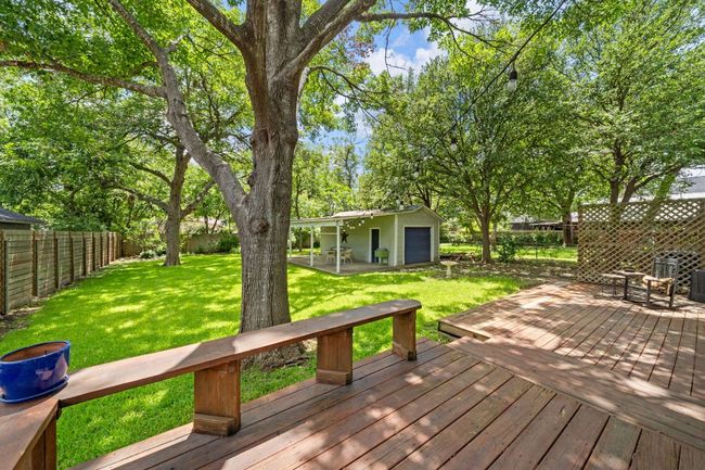 Wooden terrace featuring a fenced backyard | Image 10