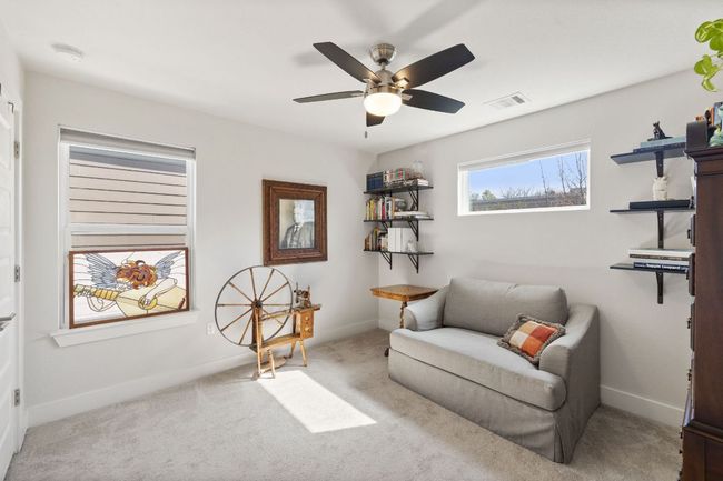 Sitting room featuring a ceiling fan, carpet floors, baseboards, and visible vents | Image 22