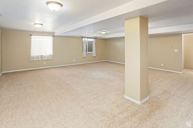 Basement with carpet floors and baseboards | Image 33