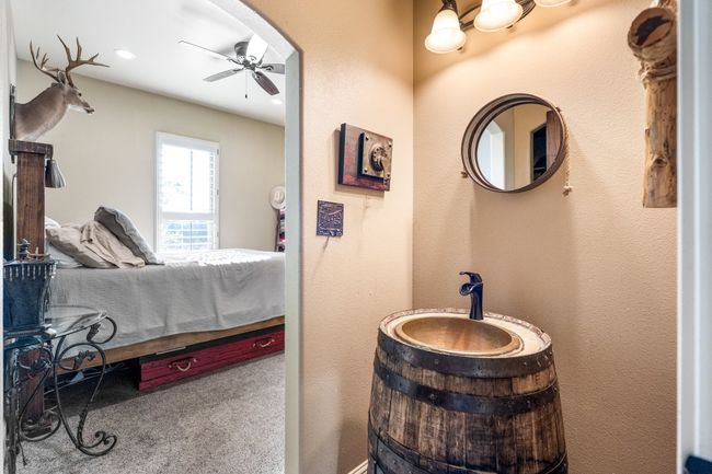 Carpeted bedroom with arched walkways and recessed lighting | Image 24