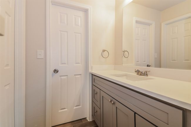 Bathroom with vanity and wood finished floors | Image 19