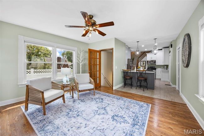 Living area with ceiling fan, light wood-type flooring, and recessed lighting | Image 14