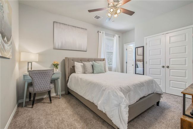 Bedroom with carpet floors, a closet, and a ceiling fan | Image 20
