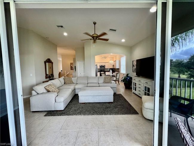 View from Lanai into living room before furniture was removed. | Image 16