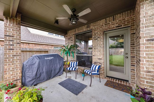 Beautiful serene back patio with the in-home sound system speakers and ceiling fan. | Image 34