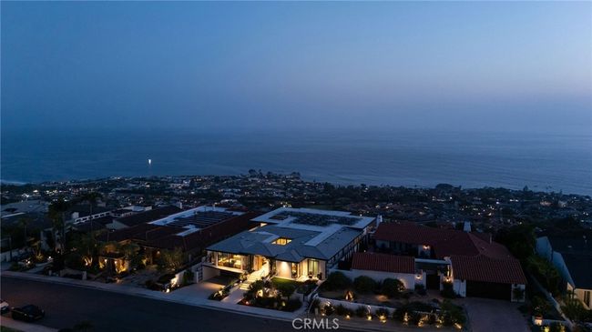 Property showcases panoramic ocean, coastline, white water, canyon and city-light views. | Image 39