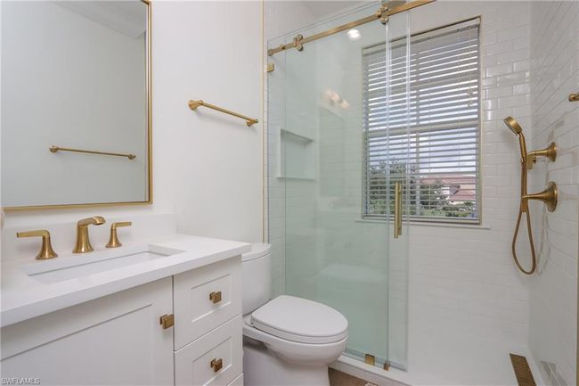 Full bathroom featuring a shower stall and vanity | Image 19