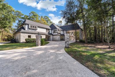 Stately Estate Home on a heavily wooded 2.2 acre lot, backing to the golf course. | Image 1