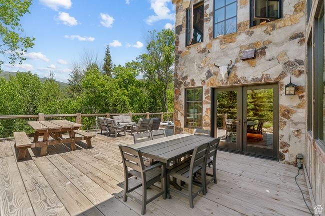 Wooden terrace with outdoor dining area and outdoor lounge area | Image 51