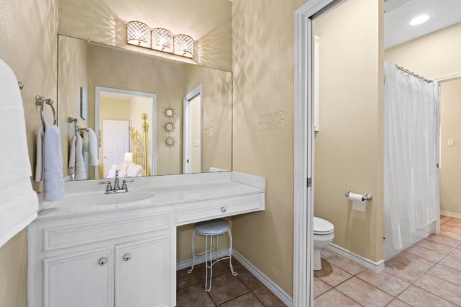 Bathroom with tile patterned floors, baseboards, toilet, and vanity | Image 30