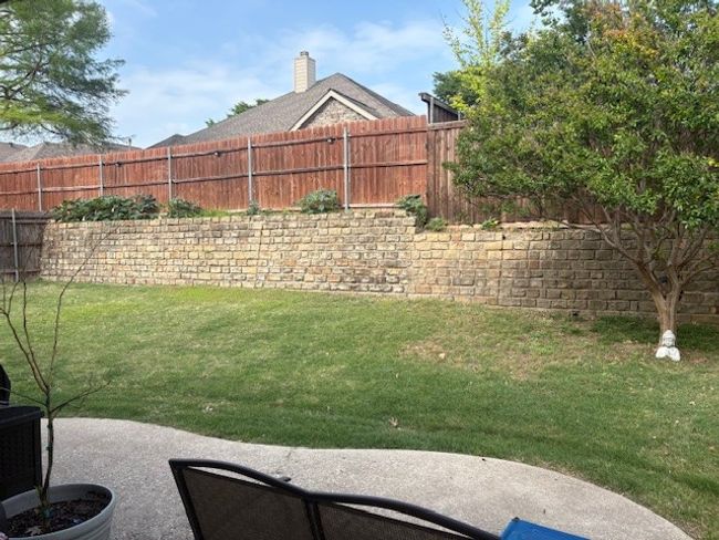 View of yard with a patio area and a fenced backyard | Image 21