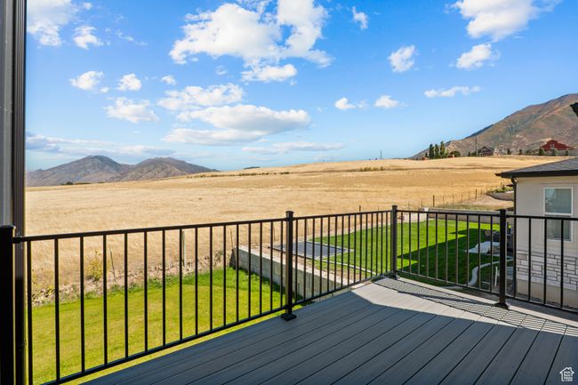 Deck with a mountain view, a yard, and a rural view | Image 43